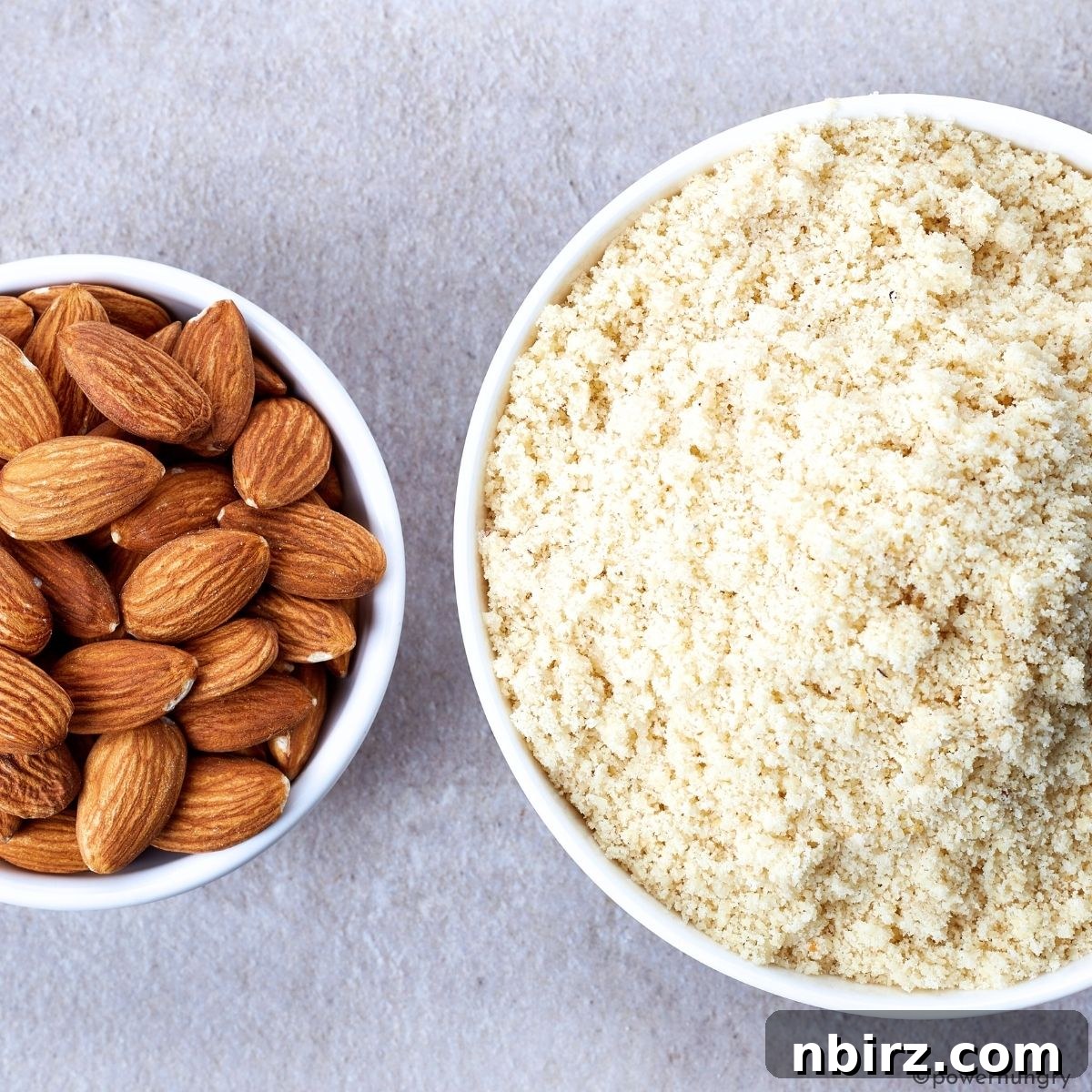Grain Free Oil Free Vegan Almond Flour Zucchini Muffins 4 Two contrasting bowls, one filled with whole blanched almonds and the other with fine, pale almond flour, illustrating the transformation.