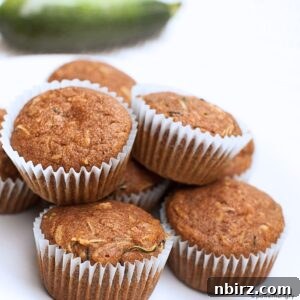 A pile of healthy vegan almond flour zucchini muffins, perfect for a guilt-free treat.