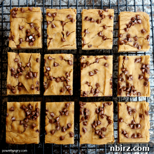 A single vegan peanut butter chickpea blondie, cut and ready to eat