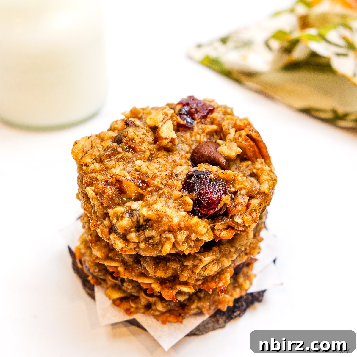 Wholesome Two-Ingredient Banana Oat Cookies 12 A perfectly arranged stack of three 2-ingredient banana oat cookies, inviting and wholesome.