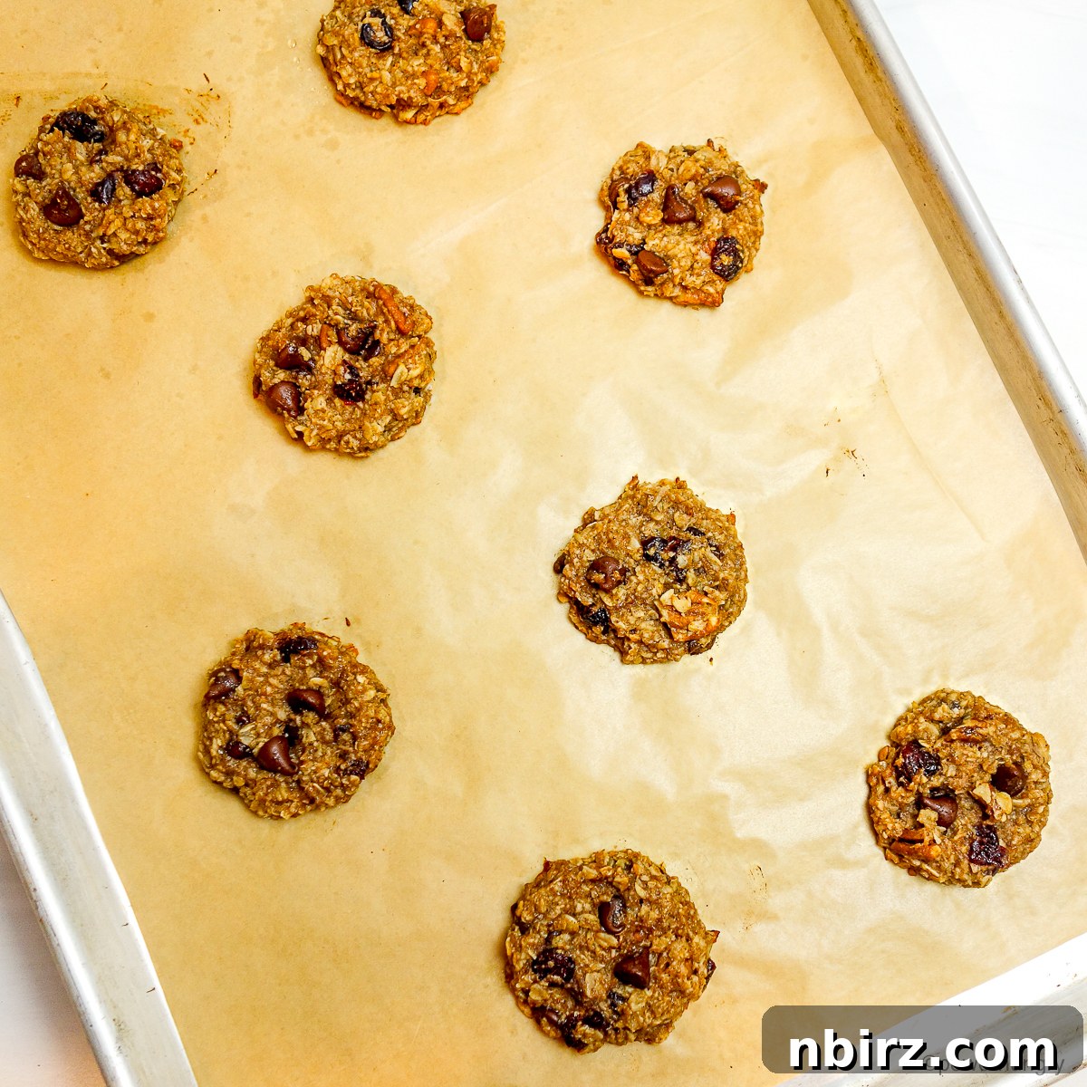 Wholesome Two-Ingredient Banana Oat Cookies 8 A baking sheet filled with perfectly baked 2-ingredient banana oat cookies, fresh from the oven.