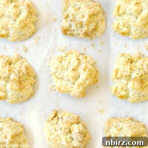 overhead shot of Irish soda bread biscuits on a parchment lined baking sheet