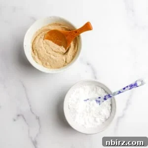 Two white bowls filled with homemade grain-free powdered sugar