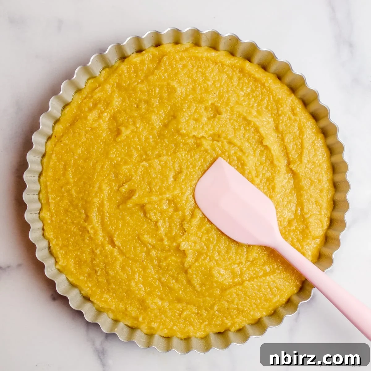 Vegan Raspberry Tart: A Gluten-Free Delight 5 Dough for vegan no-crust raspberry almond tart spread in a metal tart pan