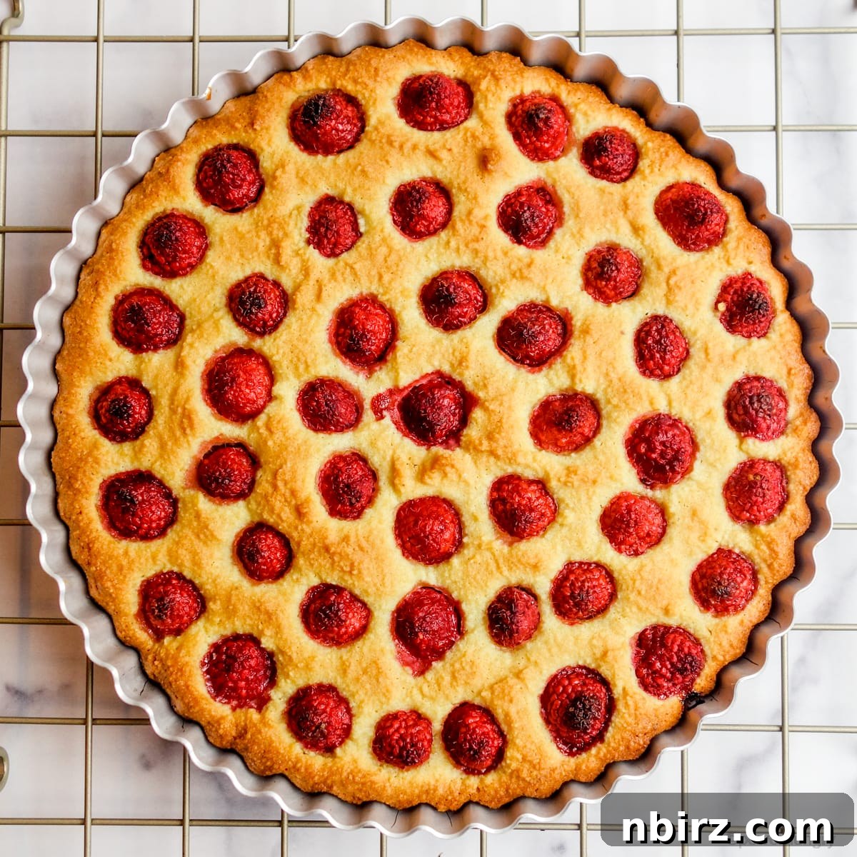 Vegan Raspberry Tart: A Gluten-Free Delight 7 Baked vegan raspberry tart cooling on a cooling rack