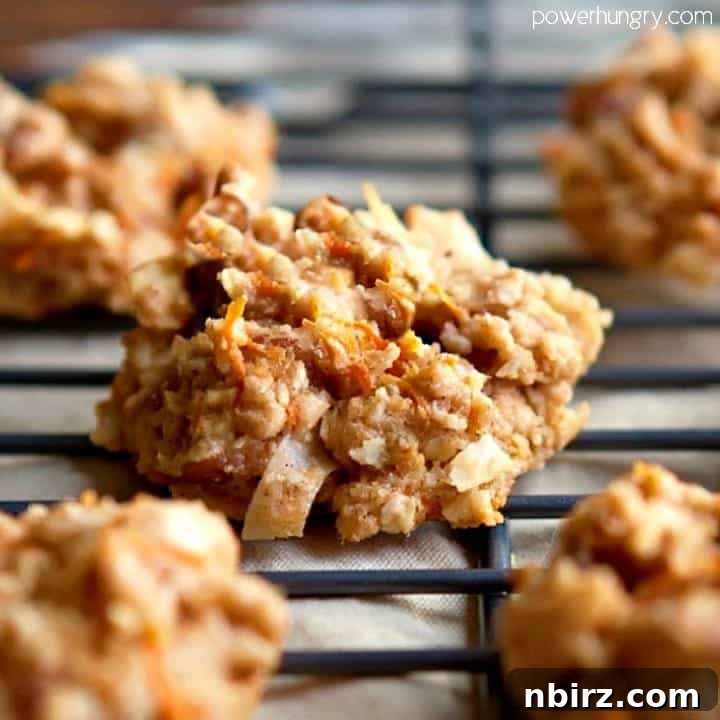 Oat Carrot Cake Cookies: A Guilt-Free Treat 2 Close-up of a healthy carrot cake breakfast cookie on a black metal cooling rack