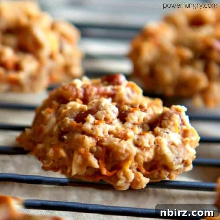 Oat Carrot Cake Cookies: A Guilt-Free Treat 3 Close-up of a healthy oat and almond flour carrot cake cookie on a cooling rack