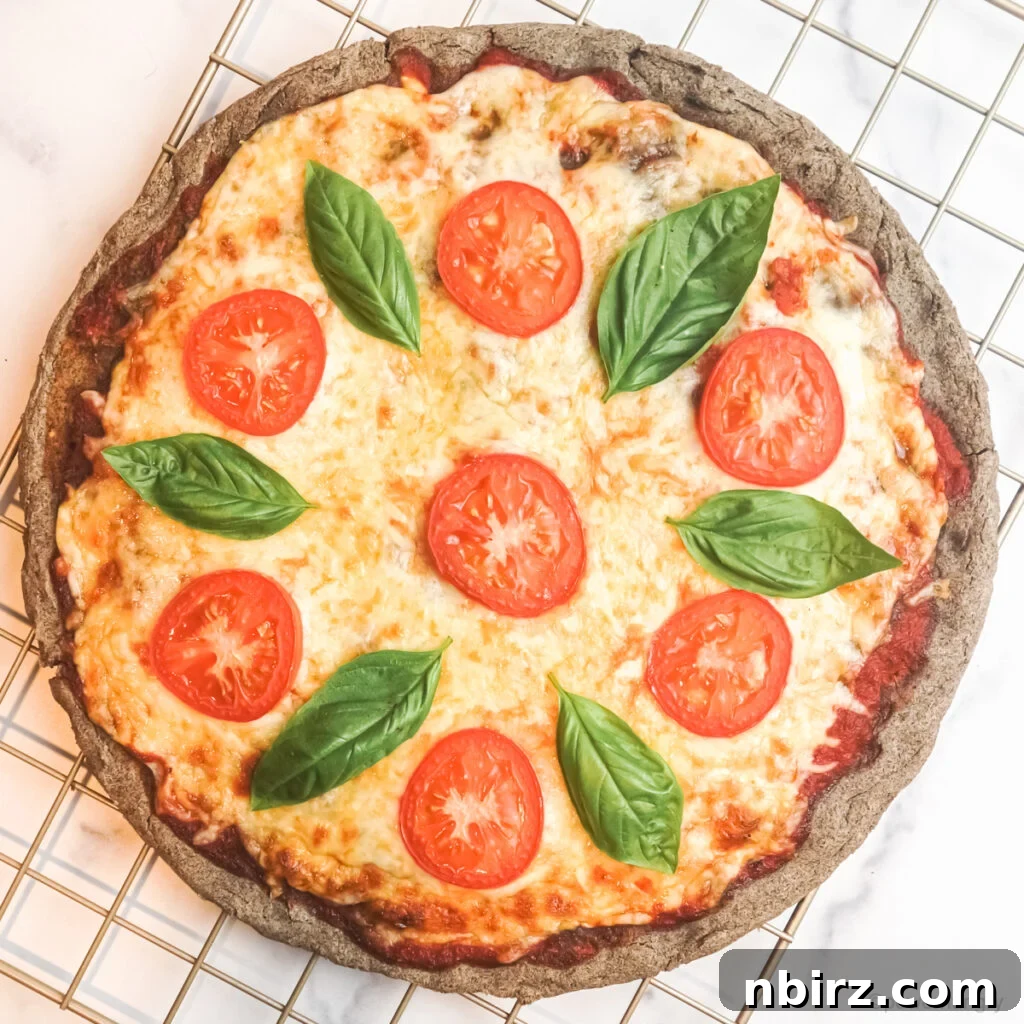 Two-for-Tea Buckwheat Pizza: Simplicity on a Slice 8 A fully baked buckwheat pizza with melted cheese and colorful toppings, ready to be enjoyed.