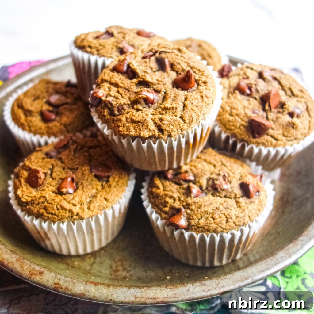 A charming pile of freshly baked vegan gluten-free buckwheat muffins nestled in an antique pie tin, ready to be served.