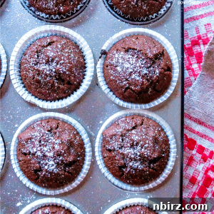 Chocolate chickpea flour muffins in a metal tin