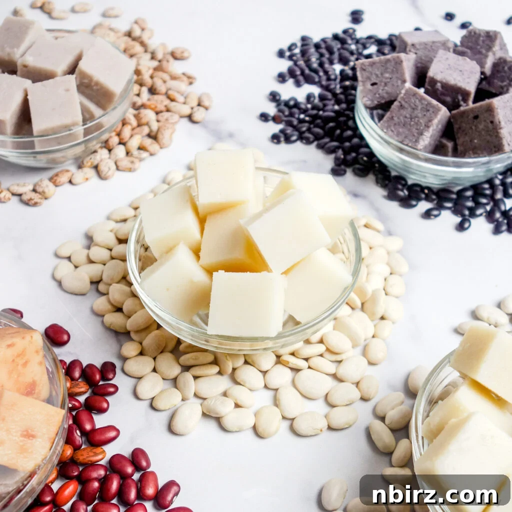 multiple glass bowls filled with various types of bean tofu