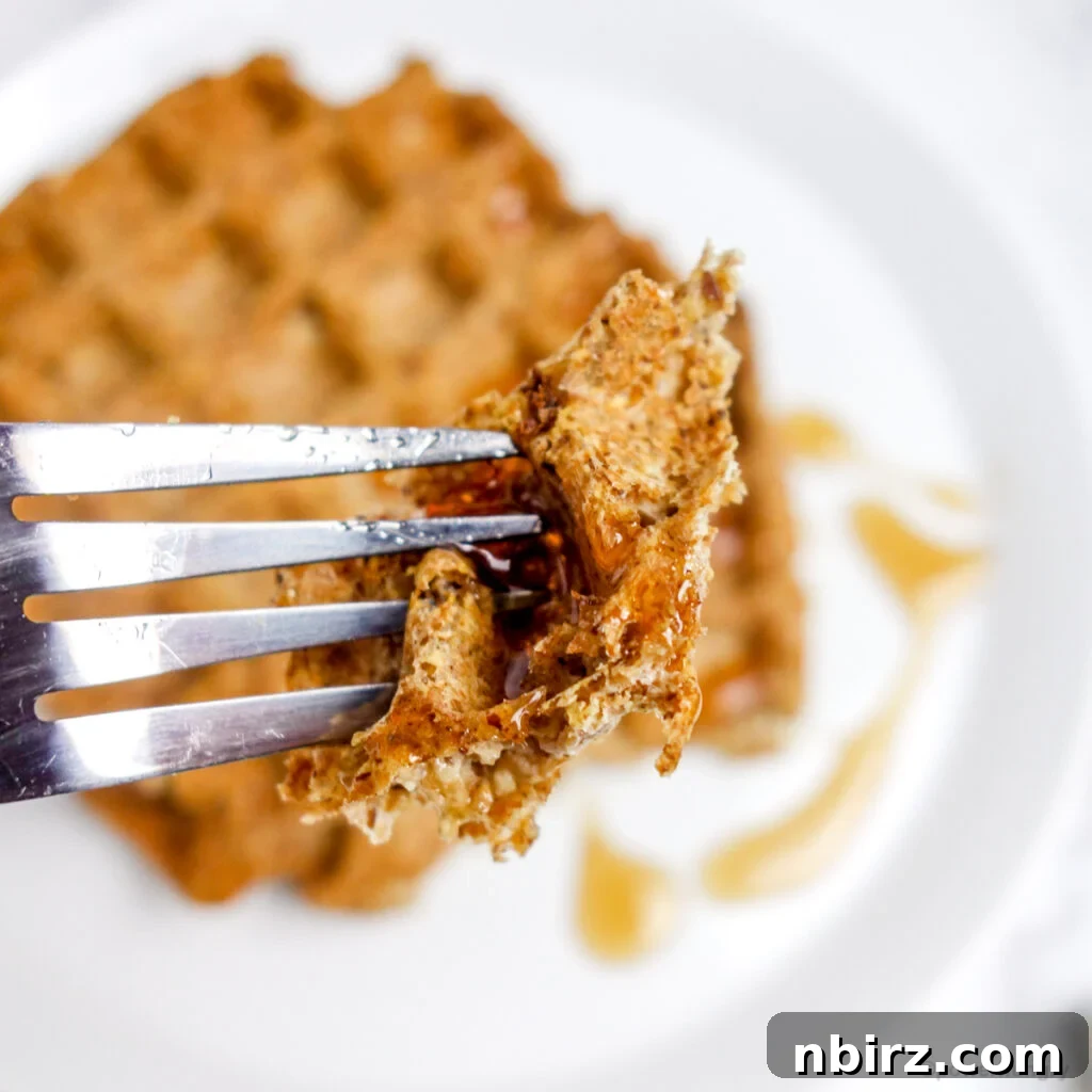 One-Bowl Vegan Flax Waffles (Keto, Gluten-Free Option) 11 Close-up of a piece of flax waffle with syrup, highlighting its texture and deliciousness