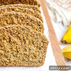 Close up of slices of vegan oat flour banana bread, sliced, on a cutting board