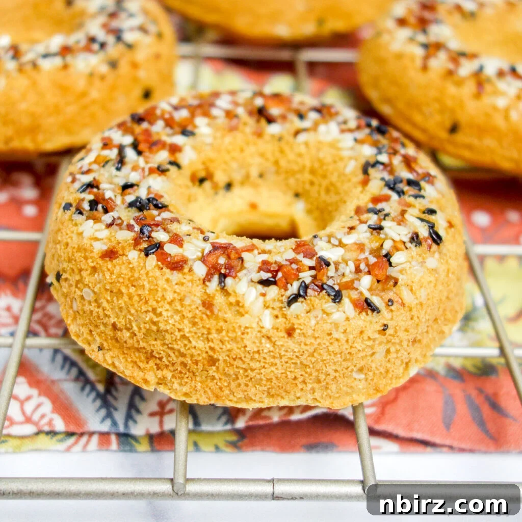 Fluffy Oil-Free Gluten-Free Vegan Chickpea Bagels 7 close-up of chickpea flour bagels on a gold cooling rack