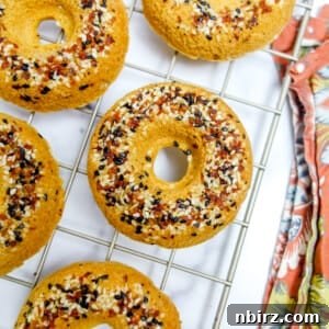 Fluffy Oil-Free Gluten-Free Vegan Chickpea Bagels 8 chickpea flour bagels on a wire cooling rack