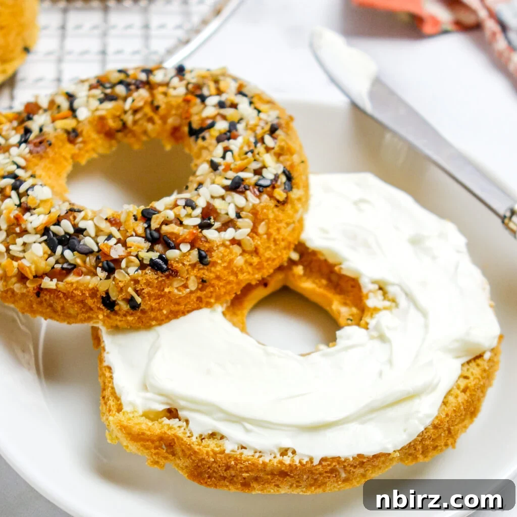 Fluffy Oil-Free Gluten-Free Vegan Chickpea Bagels 3 sliced chickpea flour bagels with cashew cream cheese spread on it