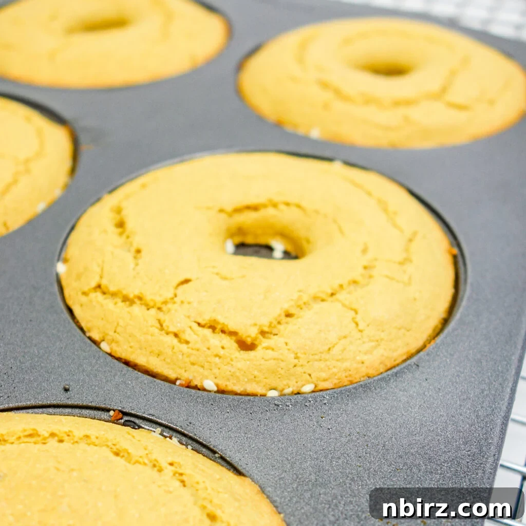 Fluffy Oil-Free Gluten-Free Vegan Chickpea Bagels 6 vegan chickpea flour bagels, fresh out of the oven in a donut pan