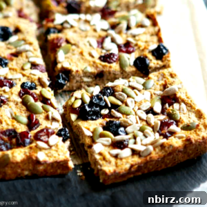 coconut flour and flax breakfast bars, cut into squares on a slate cutting board