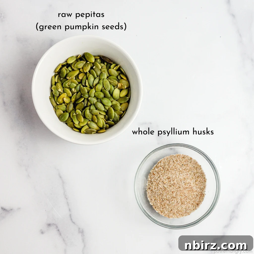 Two-Ingredient Protein-Packed Pumpkin Seed Tortillas 4 Two glass bowls displaying the simple ingredients: one filled with vibrant green pepitas, the other with fluffy whole psyllium husks.