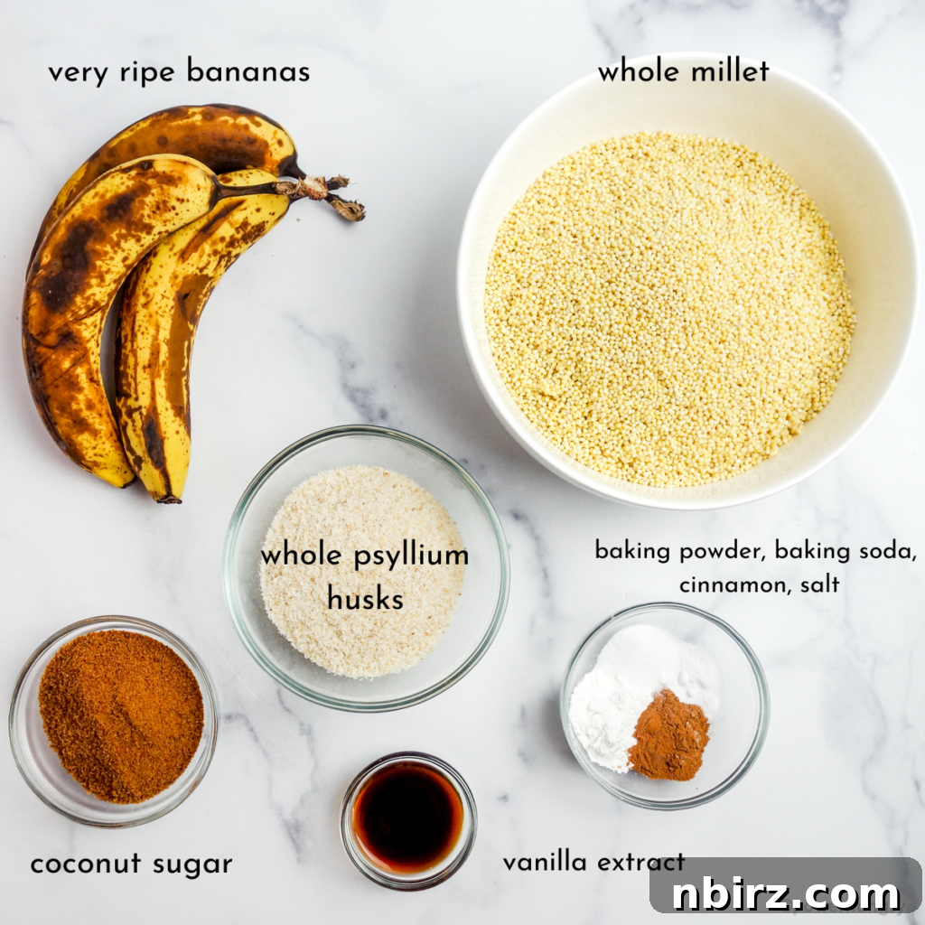 overhead shot of the ingredients for millet banana bread on a marble surface