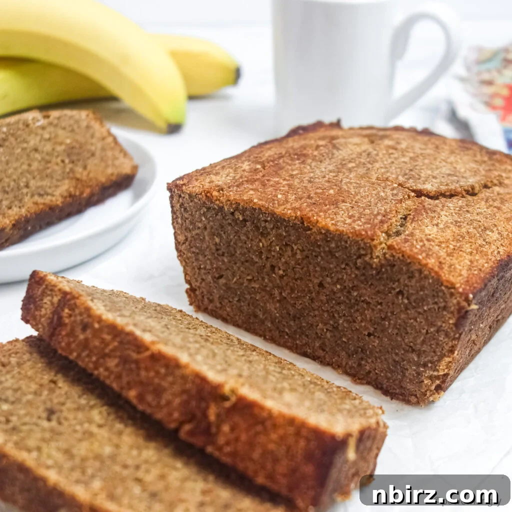 a sliced loaf of vegan coconut flour banana bread