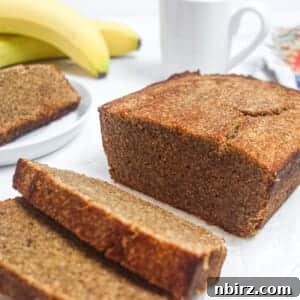 a sliced loaf of vegan coconut flour banana bread