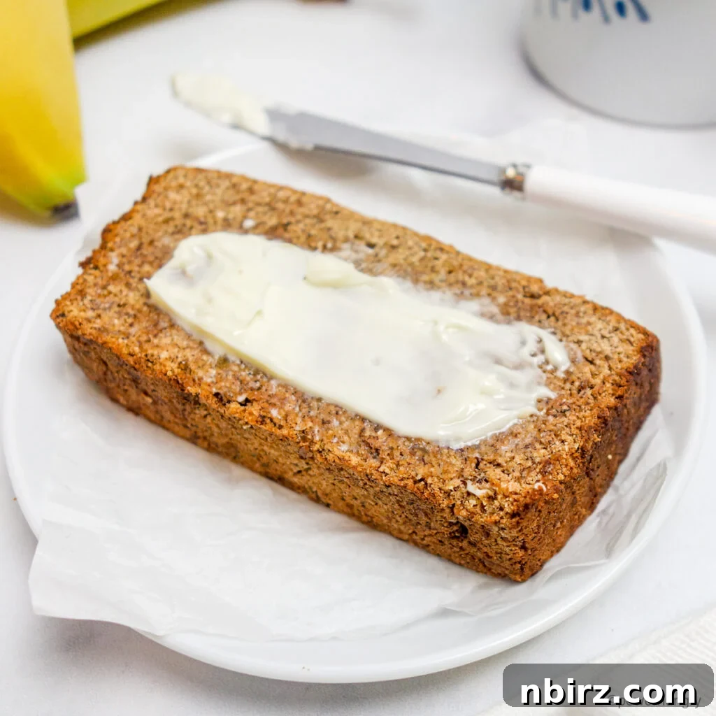 a slice of coconut flour banana bread on a white plate