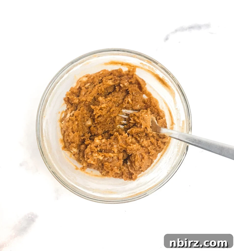 Effortless Two-Ingredient Vegan Gluten-Free Oil-Free Peanut Butter Banana Cookies 6 peanut butter banana cookie dough in a glass bowl