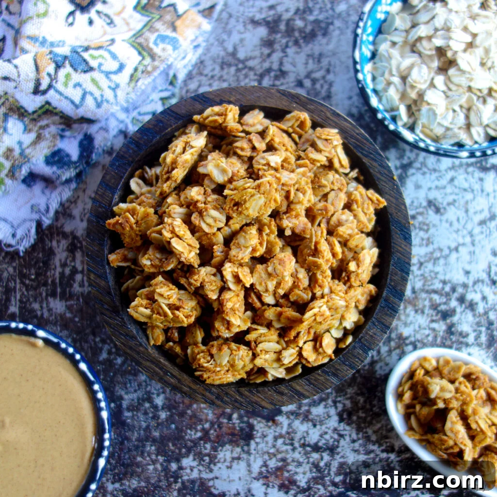 Healthy 3-Ingredient Oil-Free Peanut Butter Granola 2 peanut butter granola in a wooden bowl