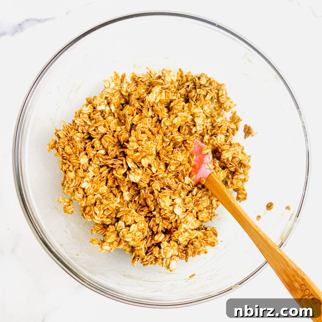 Healthy 3-Ingredient Oil-Free Peanut Butter Granola 3 peanut butter, maple syrup and oats in a glass bowl