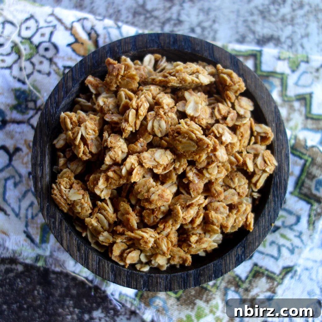 Healthy 3-Ingredient Oil-Free Peanut Butter Granola 6 bowl full of peanut butter granola on a colorful napkin
