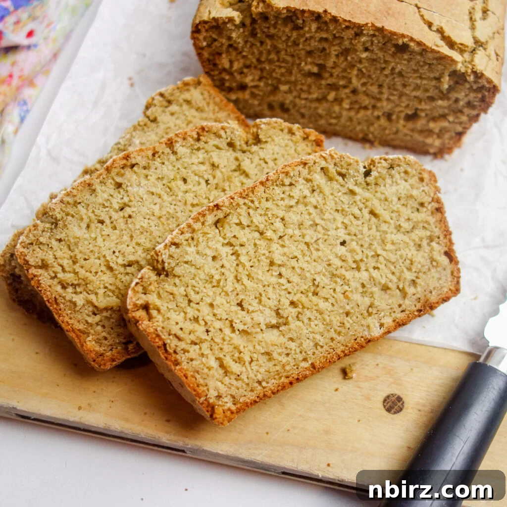 Simple Four Ingredient Gluten Free Oat Bread 2 two slices of vegan oat bread on a cutting board