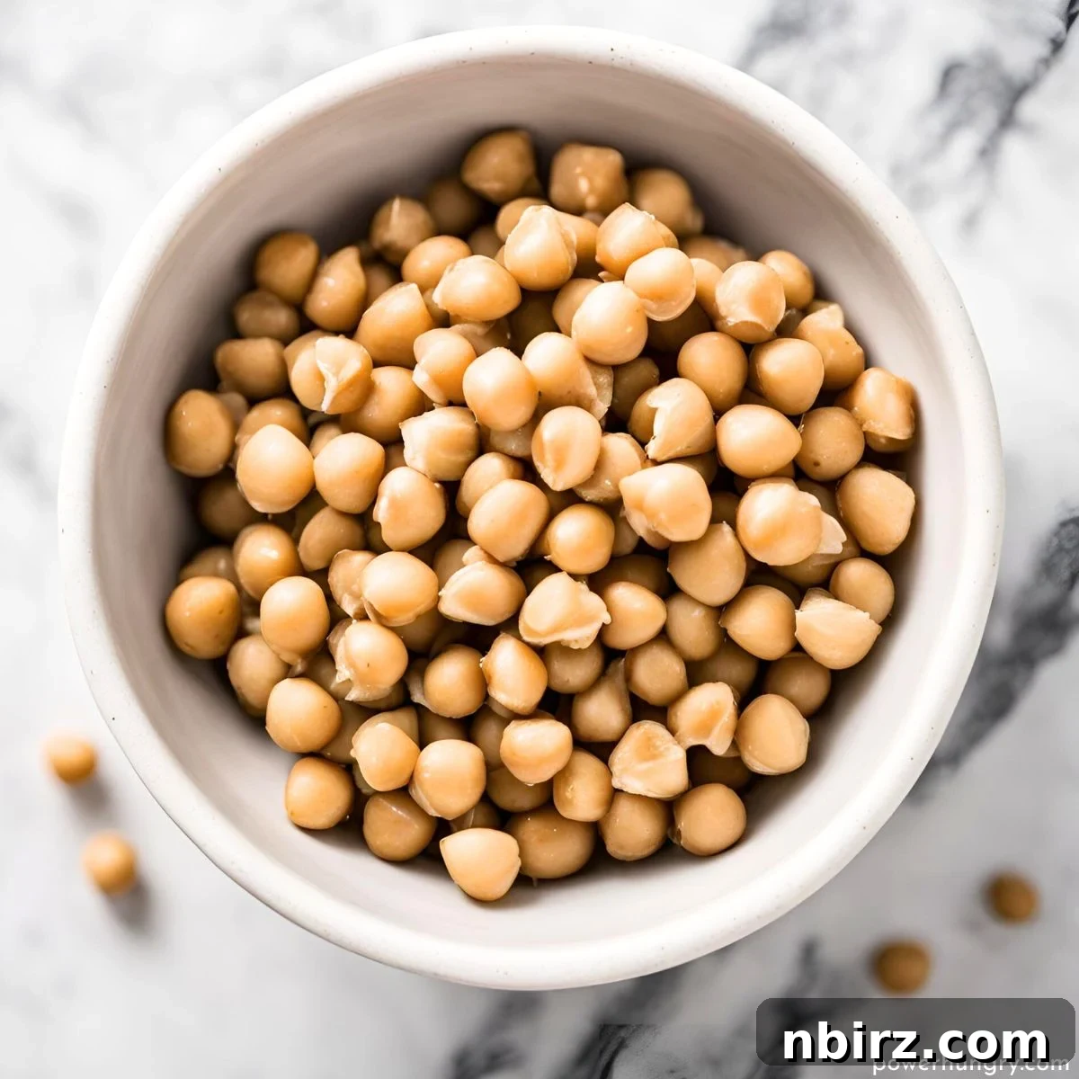 No Bake Grain Free Vegan Chickpea Protein Bites 5 Overhead shot of chickpeas in a white bowl, highlighting their natural goodness.