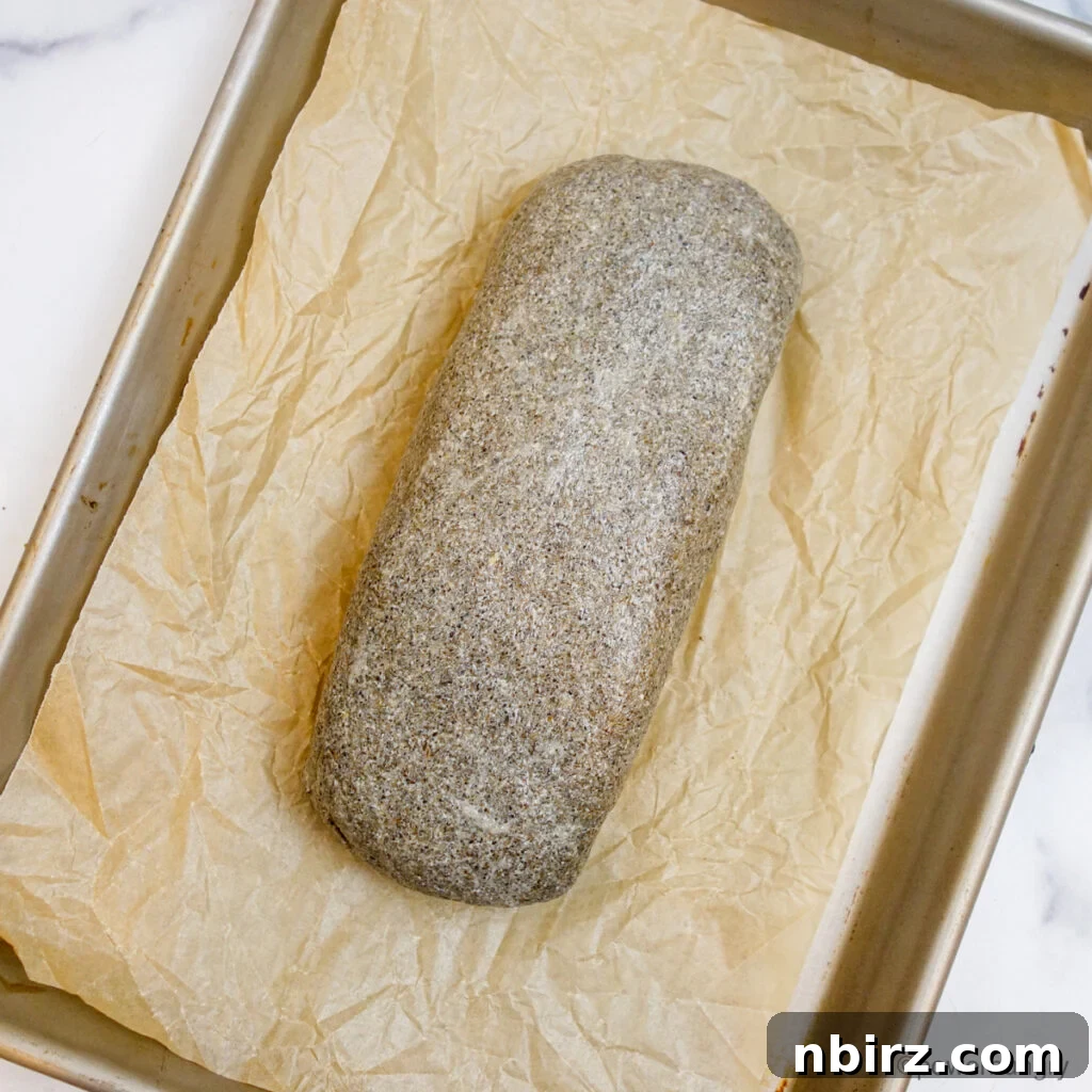 Chia sandwich bread dough, shaped into a loaf on a baking sheet