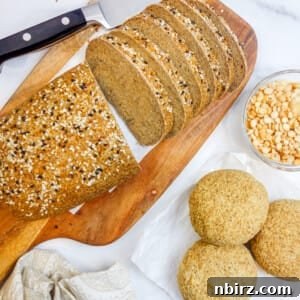 A loaf of split pea bread alongside split pea bread rolls and a bowl of yellow split peas.