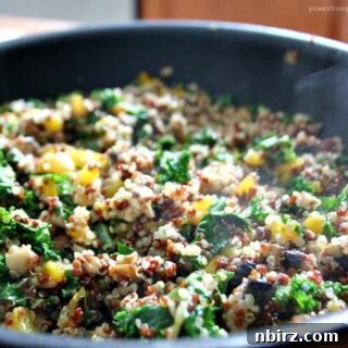 A vibrant close-up of the Quinoa Kale & Mushroom Skillet, ready to eat.