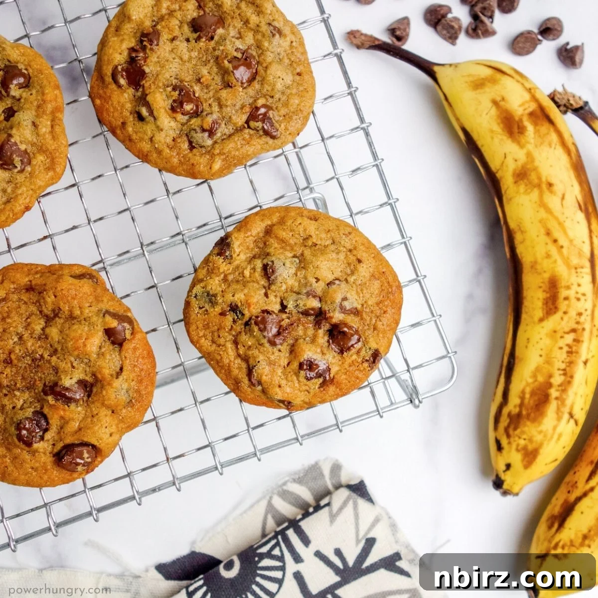 banana chocolate chip vegan cookies cooling on a wire cooling rack