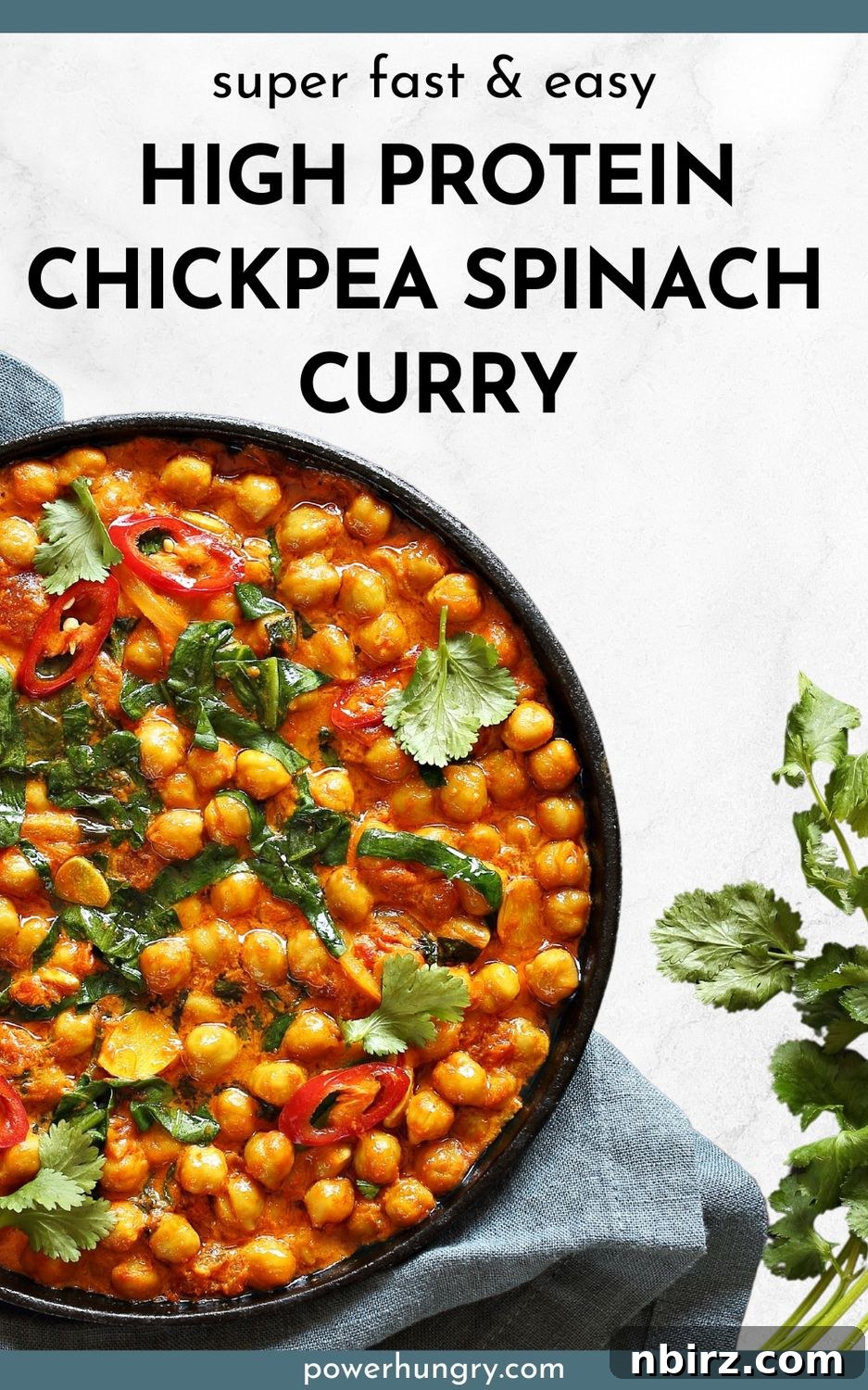 High-protein chickpea spinach curry in a dark bowl, garnished with fresh herbs and a drizzle of coconut milk.