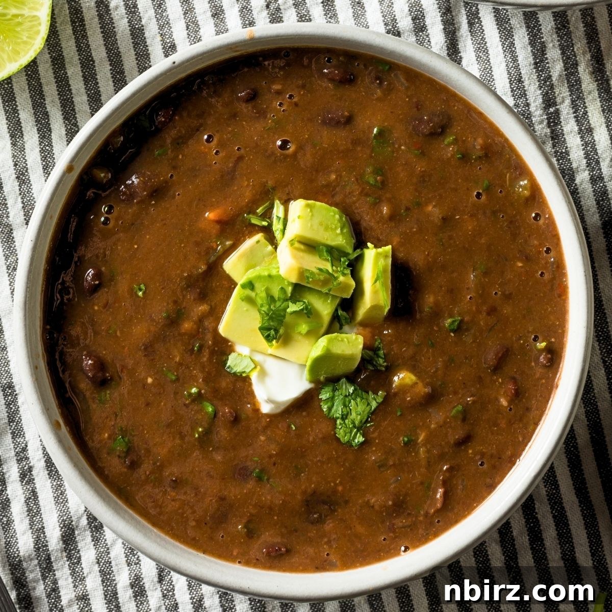 Quick Black Bean Pumpkin Soup 2 black bean pumpkin soup in a white bowl