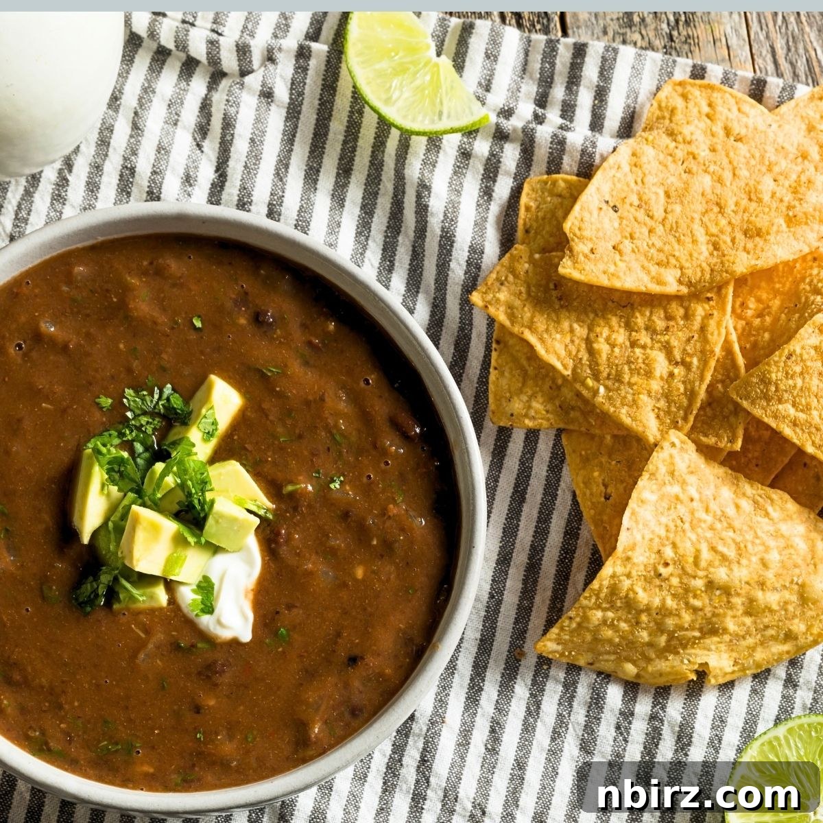 Quick Black Bean Pumpkin Soup 4 black bean pumpkin soup with some tortilla chips alongside