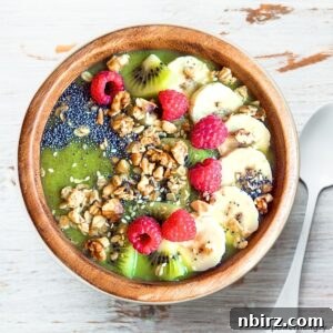 Emerald Morning Bliss 4 A vibrant green smoothie bowl, garnished with a variety of fresh toppings, presented in a recipe card format.