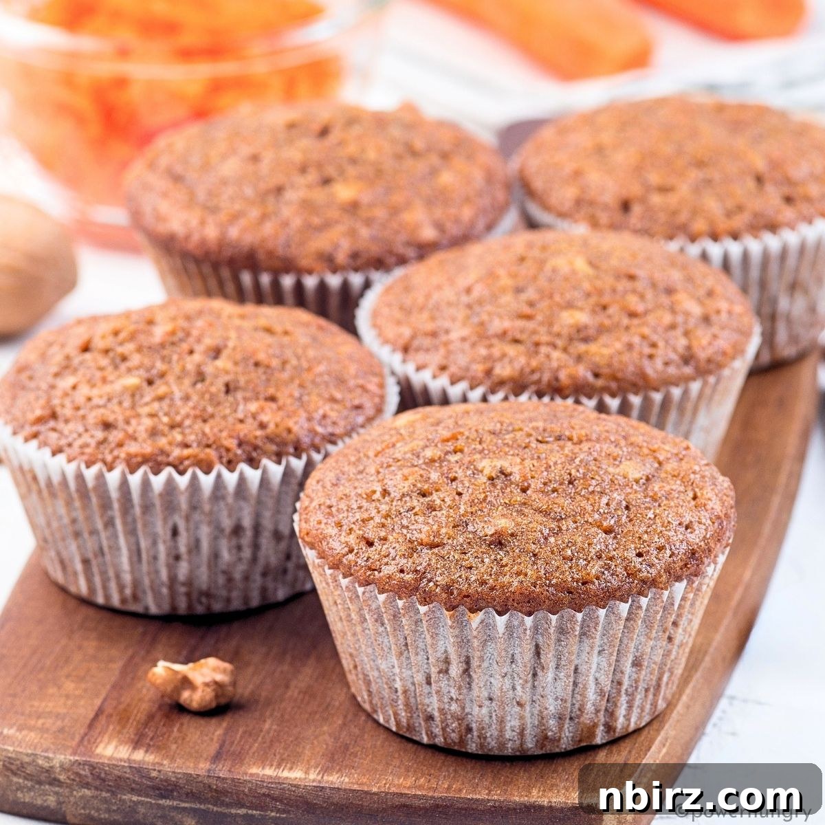 Nourishing Buckwheat Carrot Muffins 5 A cluster of golden-brown carrot muffins made with buckwheat flour, presented beautifully for serving.