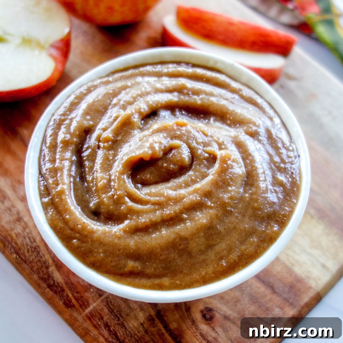 Delicious Apple Caramel Dip Close-up shot of homemade apple caramel dip in a small elegant white bowl.