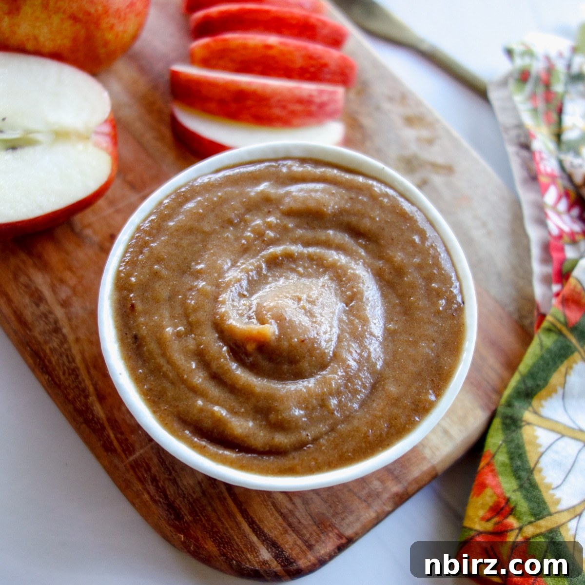 Date Caramel Dip in White Bowl Creamy date caramel dip presented in a simple white bowl, ready to be enjoyed.