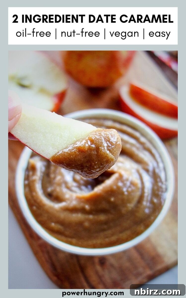Date Caramel Dip with Apple Slices Ready to Serve A bowl of creamy date caramel dip garnished with fresh apple slices, ready for a healthy snack.