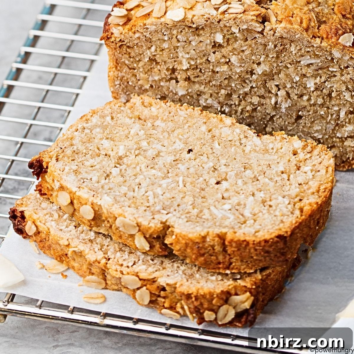 Fluffy Gluten-Free Garbanzo Oat Bread (Yeast & Oil-Free) 3 Close-up of a perfectly baked chickpea flour oat bread loaf, showing its golden-brown crust and inviting texture.