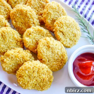 millet nuggets on a white plate with ketchup