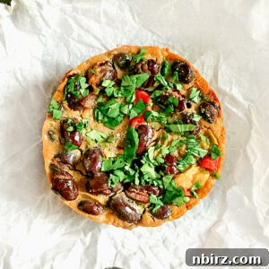 Close-up of a stack of Tex-Mex black bean vegan frittatas, highlighting their appealing texture and the visible ingredients like black beans and peppers.