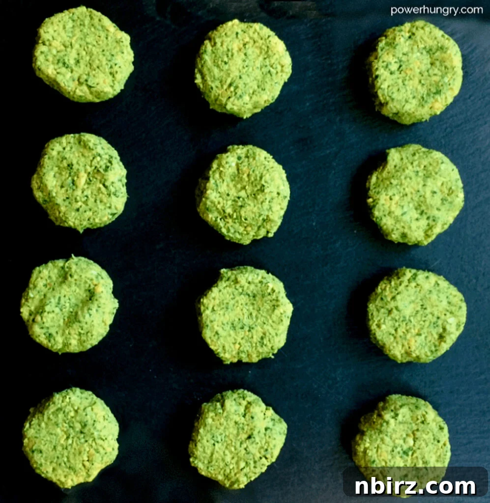 Effortless Oil Free Baked Falafel Vegan Gluten Free 3 unbaked stack of baked oil-free falafel patties on a piece of slate