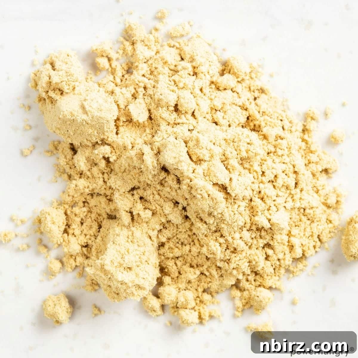 Wholesome Vegan Grain-Free Peanut Butter Muffins Oil-Free 2 A small pile of fine peanut butter powder ready for baking